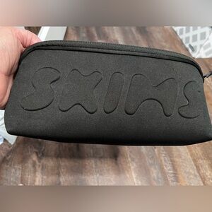 SKIMS Black Neoprene Cosmetic Travel Zippered Black Bag NWT